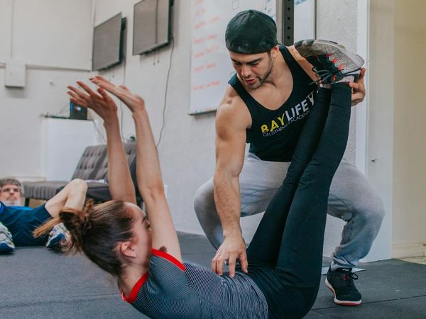 Person stretching gracefully, demonstrating improved body flexibility.
